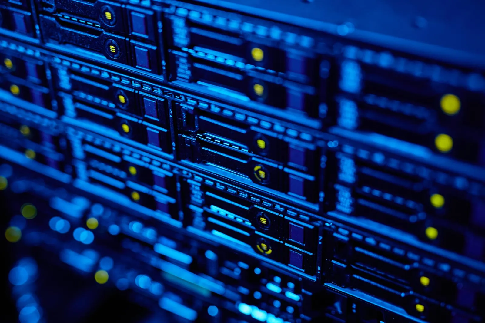 Rows of blue-lit server drives in a data centre