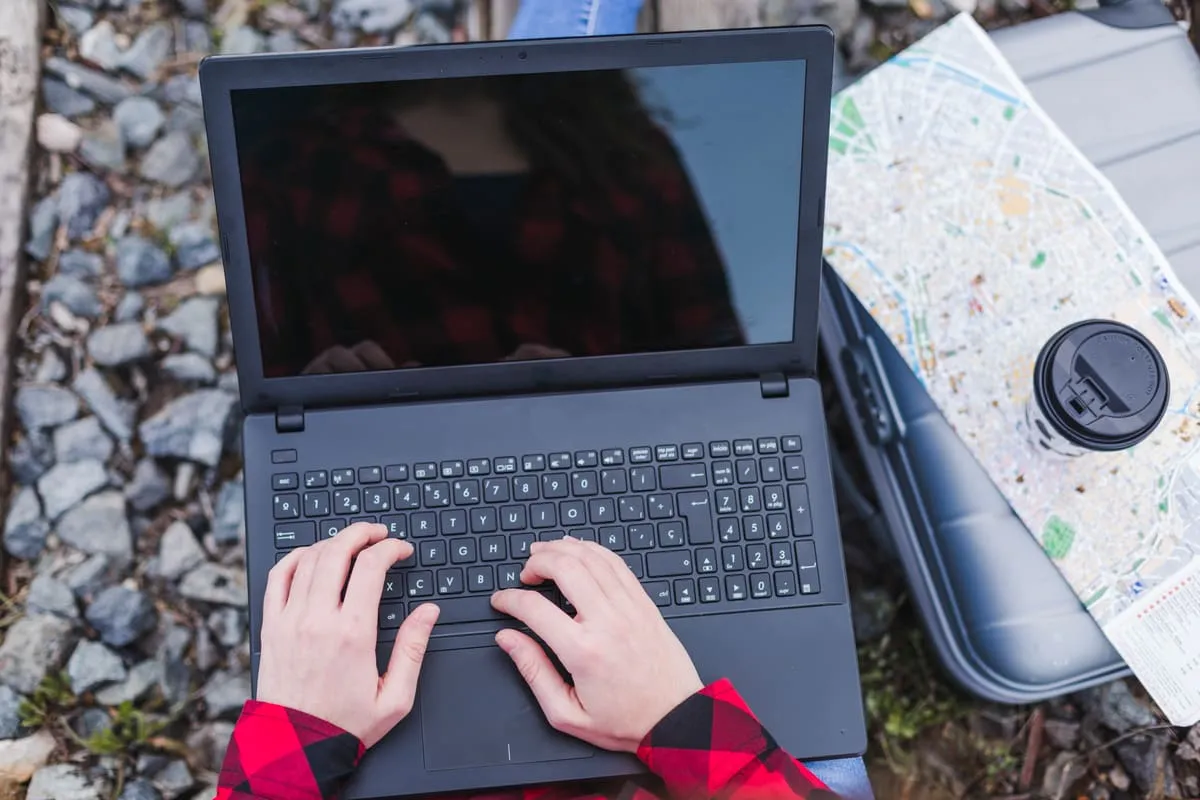 Working on a laptop on the move — cloud tools that follow your team anywhere